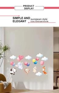 Detail of cartoon panda and elephant wall stickers with colorful balloons in a nursery