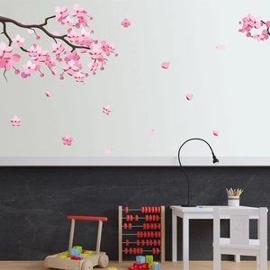 Pink cherry blossom wall stickers with branches and petals for a cozy nursery decoration