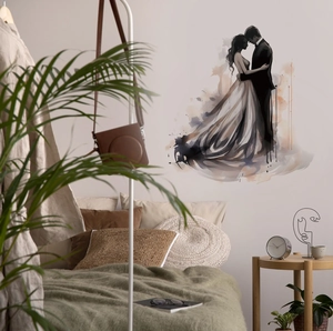 Detailed view of watercolor couple wall sticker on bedroom wall with greenery