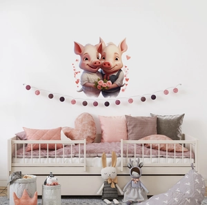 Close-up of cute cartoon wedding pigs wall decal with hearts for cozy bedroom decor