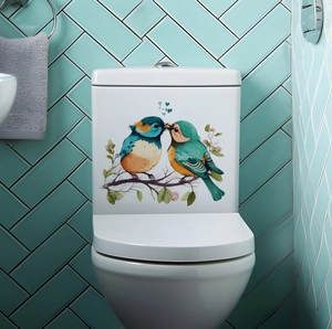 Detail showing colorful birds on branches and heart stickers on a white toilet tank