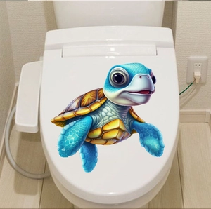 Close-up of 3D effect cartoon sea turtle sticker on white toilet lid bathroom decor