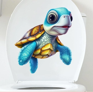 Close-up of 3D cartoon sea turtle decal applied on a white ceramic toilet lid