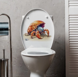 Close-up of a 3D crab decal with vibrant orange shell applied to a white toilet lid