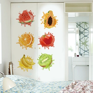 Detail of 3D fruit juice splash wall stickers on a white wardrobe for home decoration