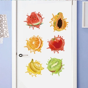 Detailed view of six colorful splash fruit wall stickers on a white wooden kitchen door