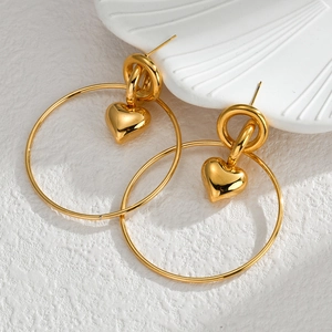 Chic gold interlocking hoop earrings with heart charms and polished mirror finish