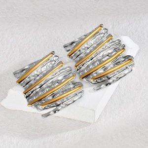Modern two-tone pleated earrings with silver wrinkled texture and golden linear accents