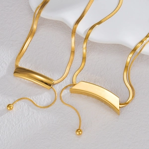 Golden baroque curved tube snake chain necklace with a high-polished mirror finish