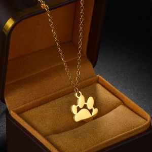 Elegant gold titanium steel cat paw pendant necklace with cable chain in a jewelry box