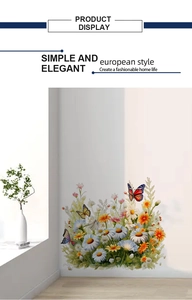 Detail of floral butterfly wall stickers with daisies and lilies on white wall background