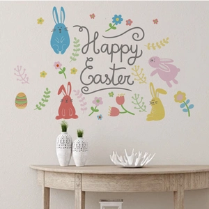 Self-adhesive Easter wall decals with colorful bunnies and eggs in a living room setting