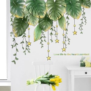 Detail der Monstera Blätter Wandaufkleber mit Love life to the heart's content Zitat