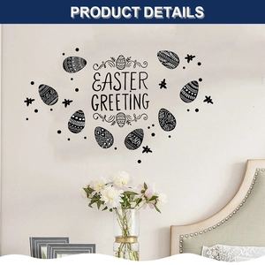 Detail of black Easter Greeting wall stickers with patterned eggs above a cozy bed frame