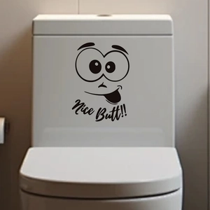 Detail of funny cartoon smiley face with Nice Butt text on a white toilet tank