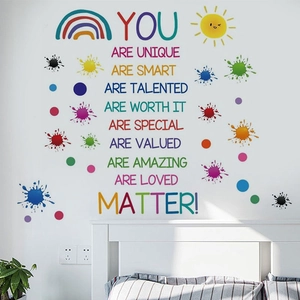 Close-up of colorful rainbow wall stickers with motivational quotes for kids' room decor