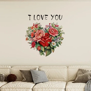 Detail view of heart-shaped floral wall decal with I LOVE YOU text on a living room wall