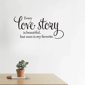 Detail of Every Love Story wall sticker in elegant black script on a white wall