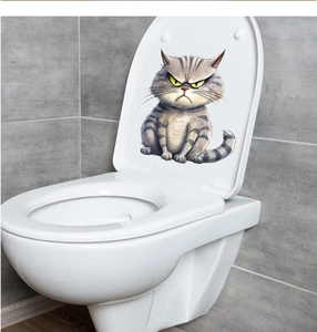Detail of grumpy grey tabby cat toilet lid sticker on modern grey marble tile background