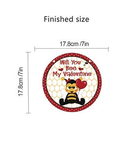 Detail showing the 7-inch circular Valentine bee wall decor with size measurements