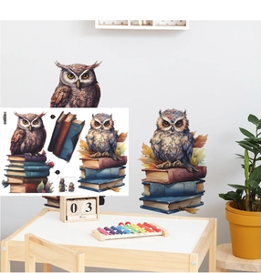 Detail of cartoon owl wall stickers on stacked books for a cozy kids' room interior