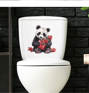 Detail of cute panda with red hearts waterproof self-adhesive sticker on white toilet