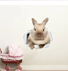 Sticker mural 3D représentant un lapin brun réaliste sortant d'un trou dans un mur blanc