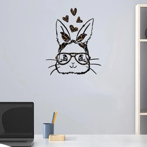 Detail of cartoon rabbit wall sticker with leopard bow and glasses in a modern office setup
