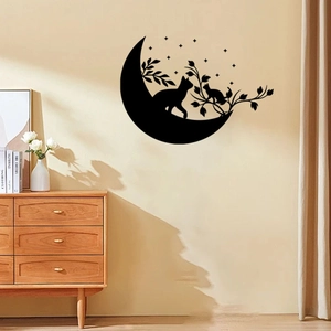 Detailed view of black cat and moon silhouette wall sticker in a cozy living room setting