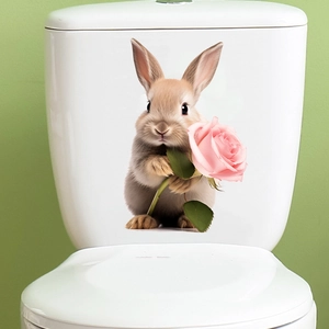 Detail of 3D bunny toilet sticker with pink rose on a white tank with green background