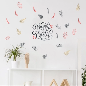 Macro detail of Happy Easter wall decal with red and black botanical leaves on a white wall