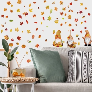 Cozy autumn living room decor featuring fall maple leaves and gnome wall decals