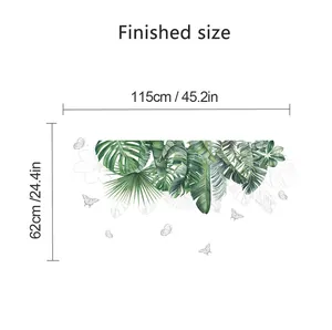 Size chart showing finished 115cm by 62cm tropical green leaves wall sticker dimensions