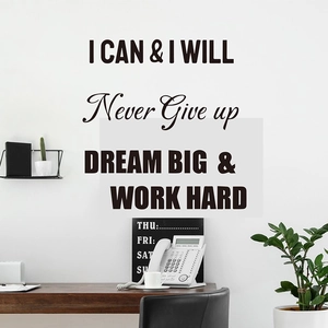 Detail of Never Give Up and Dream Big motivational vinyl wall decals in office