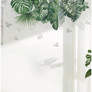 Tropical monstera and palm leaf wall decals with butterfly accents for home decor