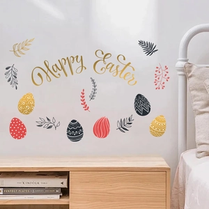 Macro view of Happy Easter wall stickers with golden fonts and colored eggs on a bedroom wall