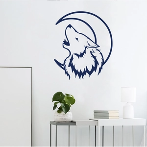 Detailed blue moon and howling wolf wall decal silhouette on a clean white living room wall