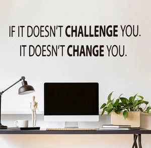 Detail of black wall sticker showing the quote If it doesn't challenge you it doesn't change you