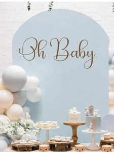 Detail view of light blue arched Oh Baby backdrop with balloons and floral party decor