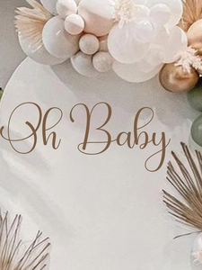 Detail of bohemian Oh Baby wall sign with decorative balloons and dried palm leaves