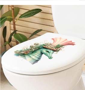 Close-up of creative seahorse art decal on a white toilet lid in a bright bathroom