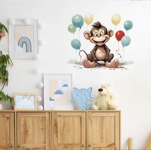 Detail of cartoon monkey wall sticker with colorful balloons in a cozy kids room decor