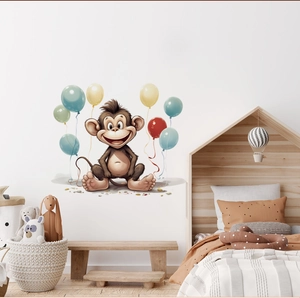 Detail of cartoon monkey wall sticker with colorful balloons in a cozy nursery room decor