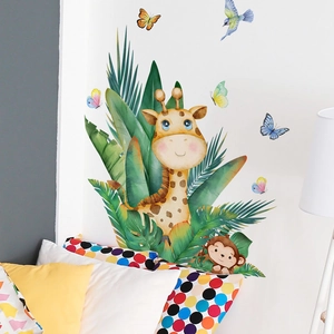 Detailed jungle scene wall sticker with giraffe and tropical leaves in a bedroom setting