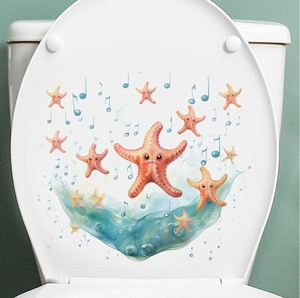 Detail of cartoon orange starfish and blue notes on waterproof PVC toilet seat sticker