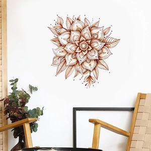 Detail of brown mandala wall decal with floral pattern in a cozy boho living room setting