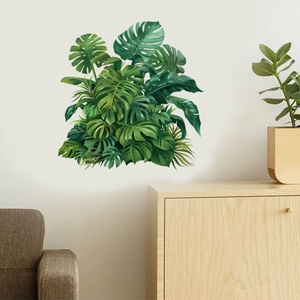 Detailed view of monstera tropical leaf wall stickers on a neutral living room wall