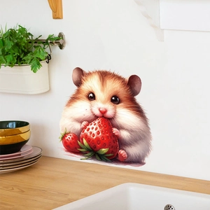 Detail of cute hamster wall sticker eating a strawberry on a clean kitchen wall