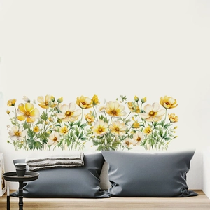 Detail of yellow watercolor floral wall stickers in a horizontal bedroom headboard layout