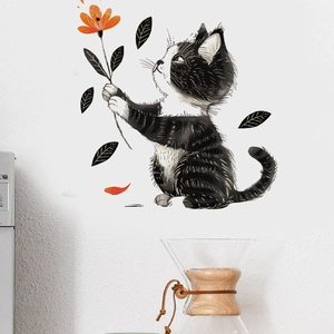 Cartoon black and white cat wall sticker holding orange flower for home decor